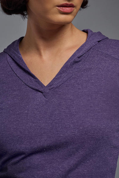 A female model wearing the women's Heather Hoodie Shirt in the color dark heather purple, showing the modern fit from a closeup collar front view. This hoodie shirt is made in the USA. #color_dark-heather-purple