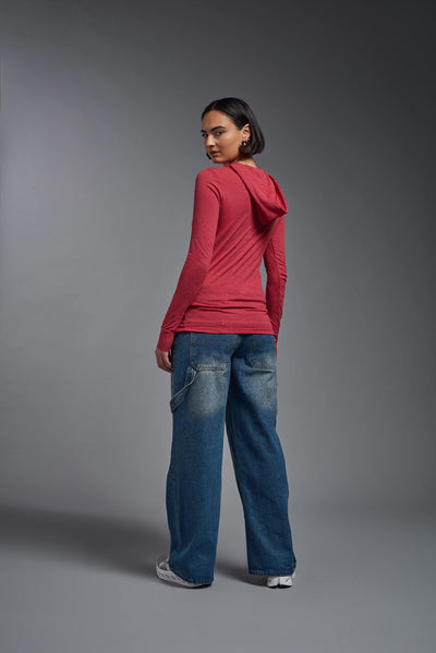 A female model wearing the women's Heather Hoodie Shirt in the color dark heather red, showing the modern fit from a back view. This hoodie shirt is made in the USA. #color_dark-heather-red
