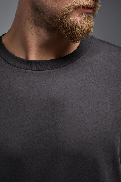 A male and female model wearing the unisex Organic Soft Cotton T-shirt in the color nova, made from 100% certified organic cotton, shot from a closeup collar front view. This shirt is unisex and made in the USA. #color_carbon