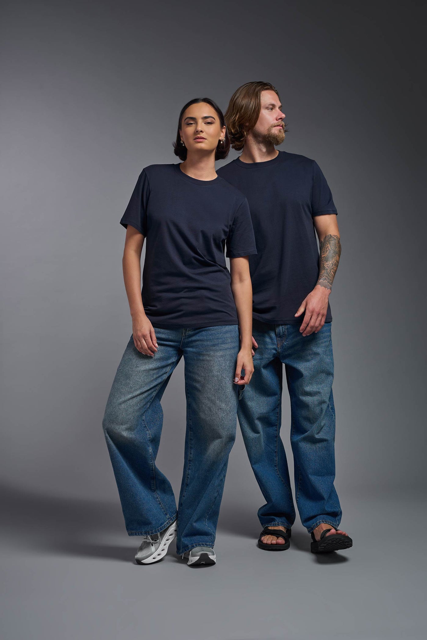 A male and female model wearing the unisex Organic Soft Cotton T-shirt in the color nova, made from 100% certified organic cotton, shot from a full body front view. This shirt is unisex and made in the USA. #color_nova
