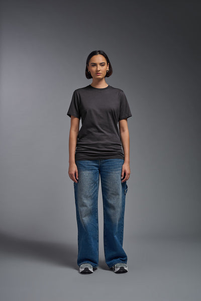 A female model wearing the unisex Organic Soft Cotton T-shirt in the color nova, made from 100% certified organic cotton, shot from a full body front view. This shirt is unisex and made in the USA. #color_carbon